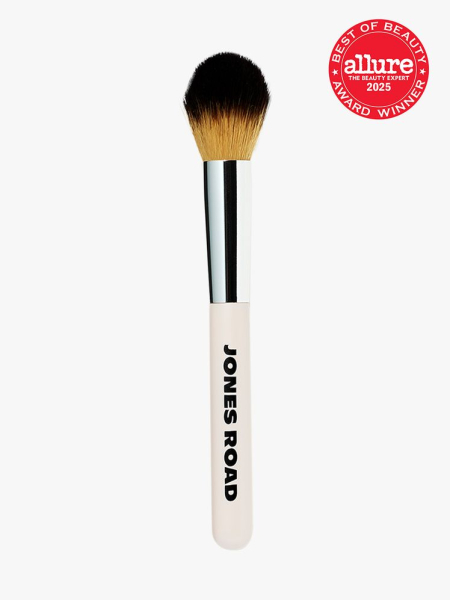 Jones Road The Blush Brush in branded tan and silver color way on light gray background with red Allure Best of Beauty seal in the top right corner
