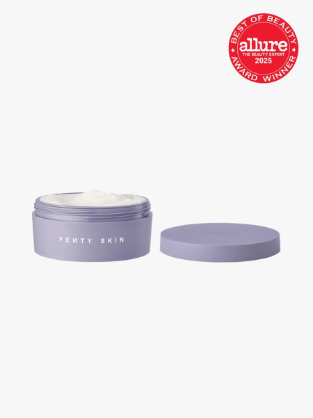 Fenty Skin Butta Drop Whipped Oil Body Cream in branded purple jar with lid on light gray background with red Allure Best of Beauty seal in the top right corner