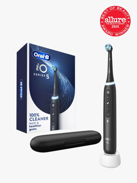 Oral-B iO Series 5 Electric Toothbrush next to charging case and branded box packaging on light gray background with red Allure Best of Beauty seal in the top right corner