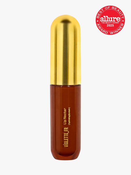 Violette_FR Lip Nectar in branded brown tube with gold cap on light gray background with red Allure Best of Beauty seal in the top right corner