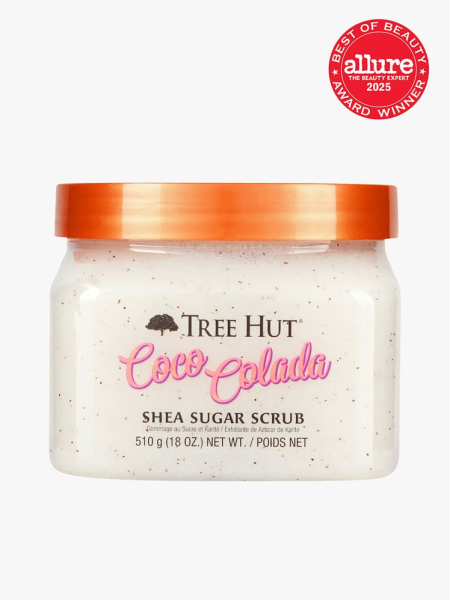 Shea Sugar Scrub in clear branded jar with orange lid on light gray background with red Allure Best of Beauty seal in the top right corner